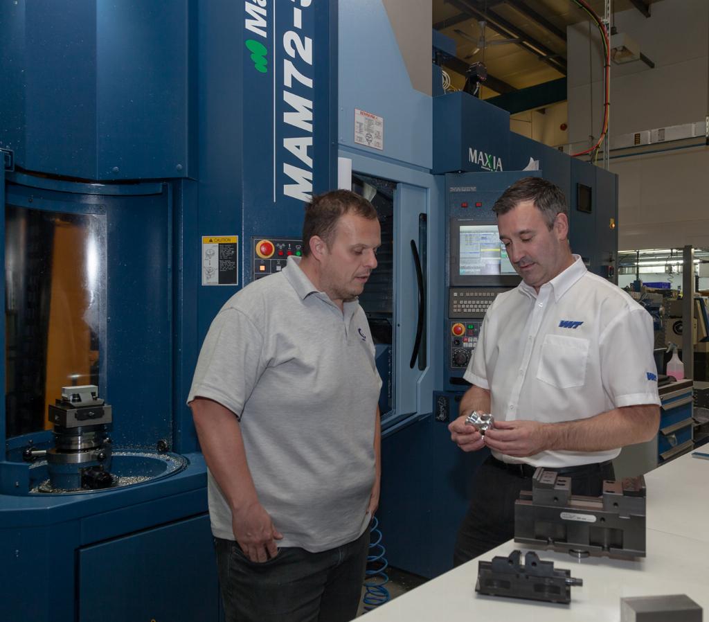 Mark Baron (left) discussing a workholding application with Warren Howard