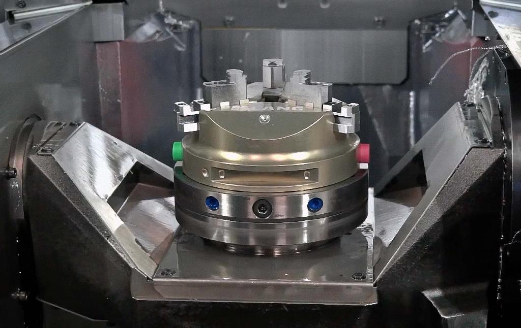 The 2,000rpm C-axis turning table is mounted on an A-axis trunnion that swi...