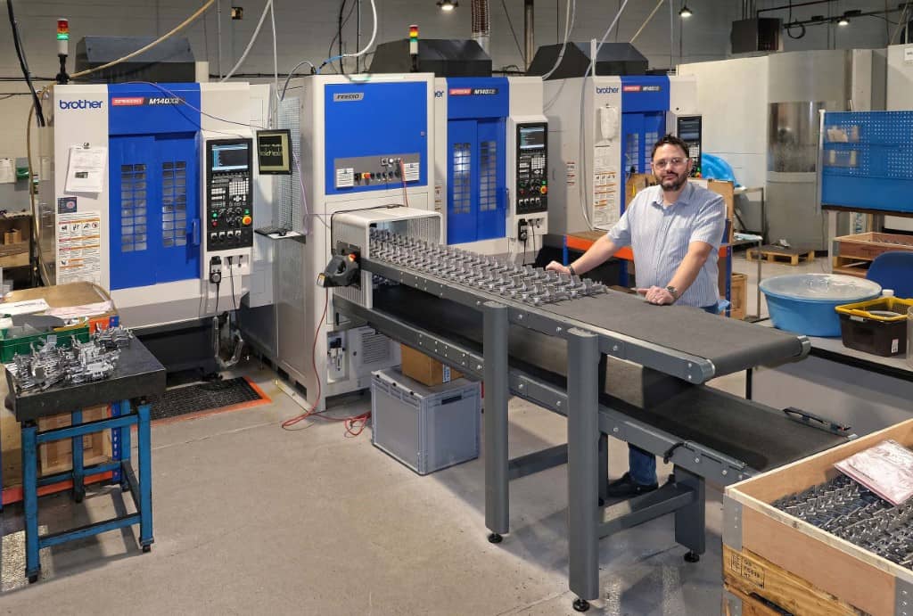 Joe Martello, owner of Roscomac, by the 5-axis automated Speedio/Feedio production cell. The manually-fed M140X2 in the background became part of an identical automated cell in April 2021