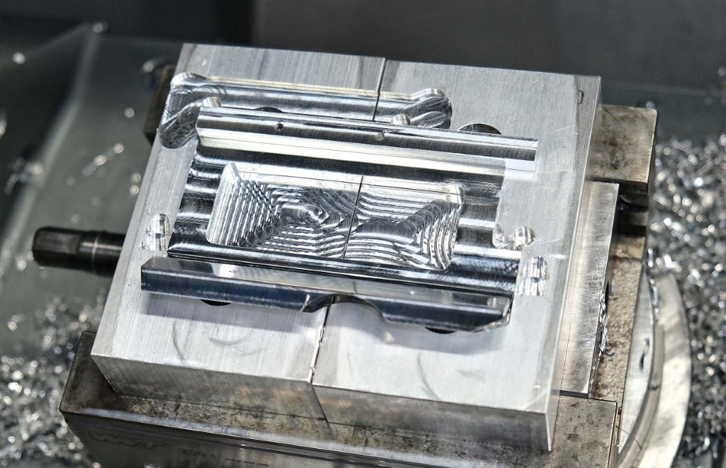 An aluminium bracket for the filtration industry being machined on a Hurco VM10Ui 5-axis VMC