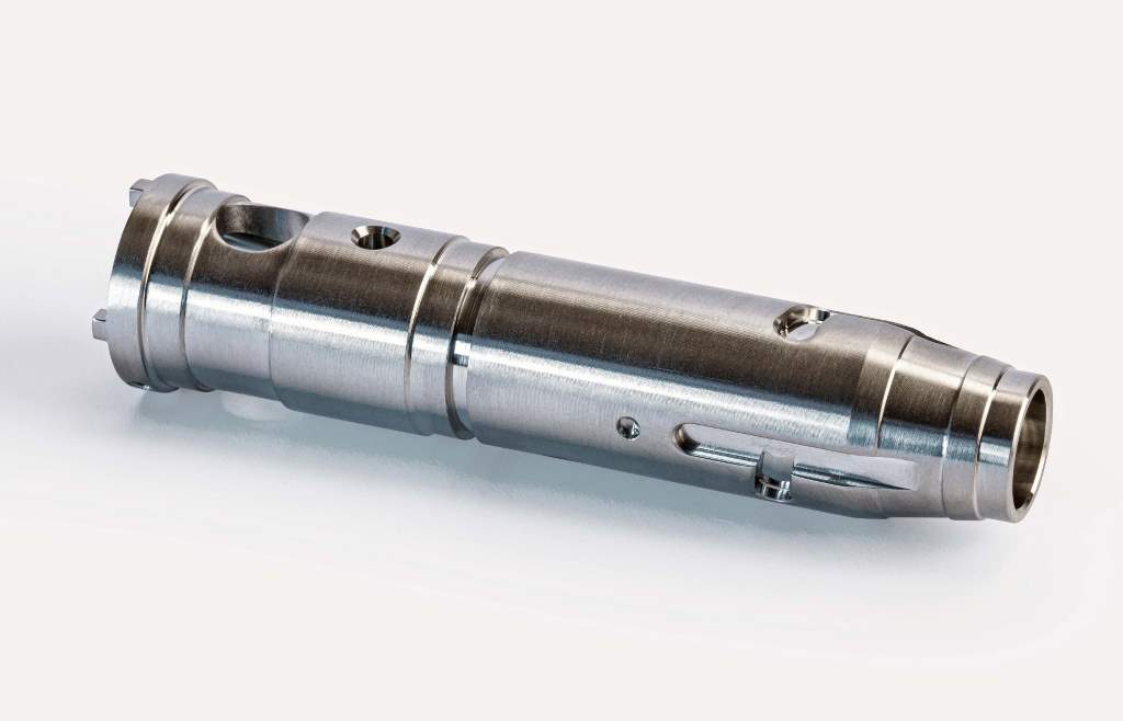 One aluminium component in a family of 12 defence industry connector parts machined by Technoset on the new Cincom M32 with LFV