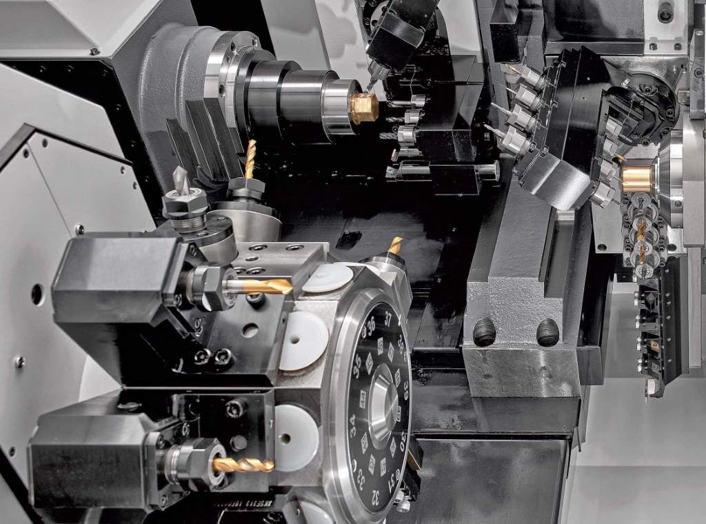 Working area of the fifth-generation Cincom M32-VIIILFV, showing the B-axis gang tool post that is now programmable to enable simultaneous 5-axis machining