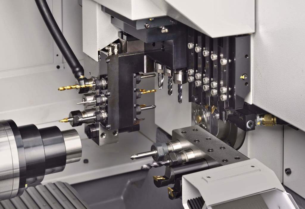 Working area of the Cincom A20-VII, showing the arrangement of linear gang tooling that is the secret behind the lathe's short idle times between cuts, leading to very high productivity