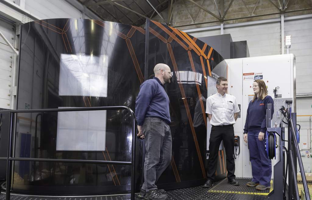 Machine operator Colin Akrigg with Matthew Darbyshire and Richard Hogg at the Ceratizit TOM 840 vendor