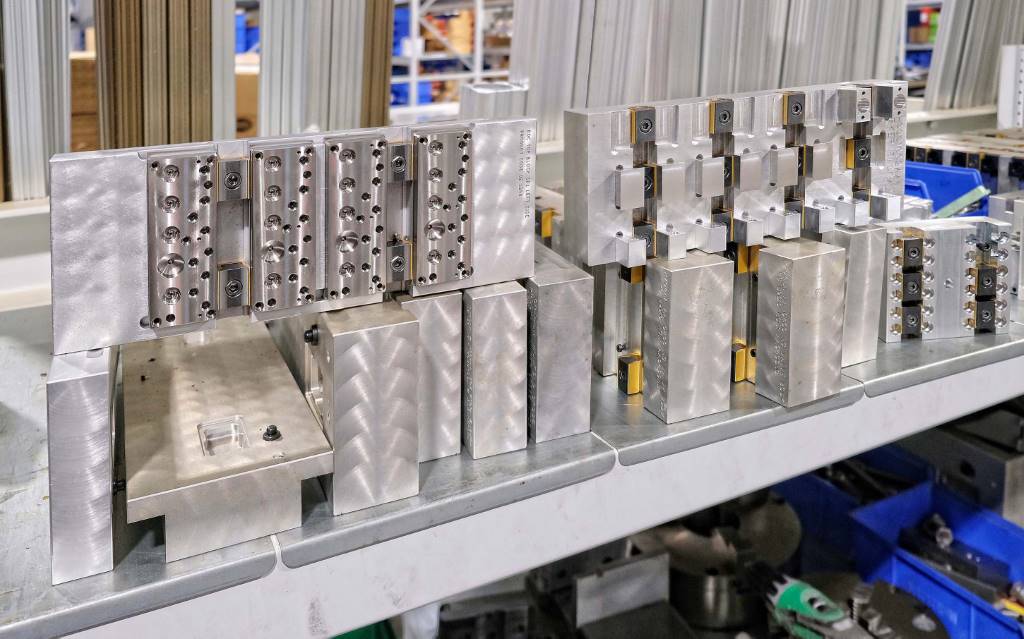 Bespoke machined faceplates, which can replace standard jaw sets on the MultiLOK towers, hold multiple smaller workpieces efficiently for machining. There are a couple of dozen faceplates in use at TecnAir